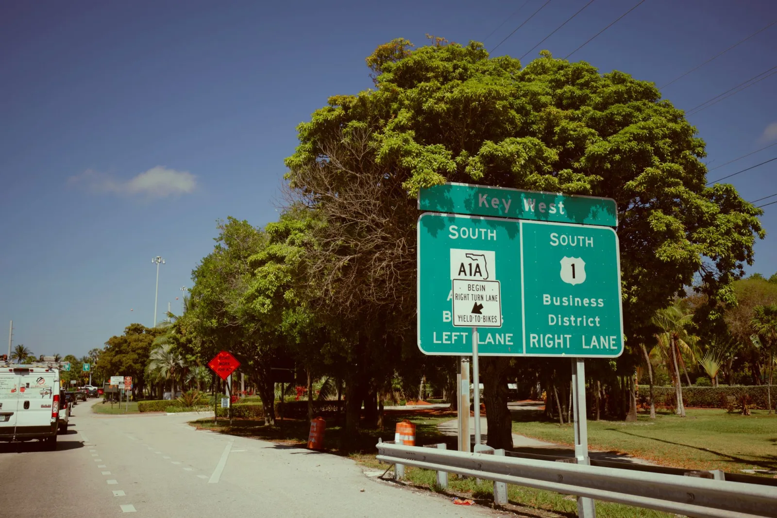 Key west directional road sign on sunny day